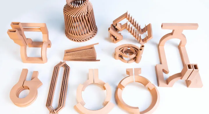 Additively manufactured copper induction coils and conductive paths